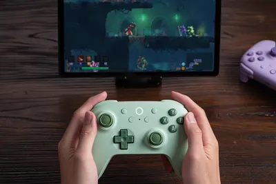 Demonstrates the product being used in a real-world gaming environment to help shoppers visualize themselves using the controller during gameplay.