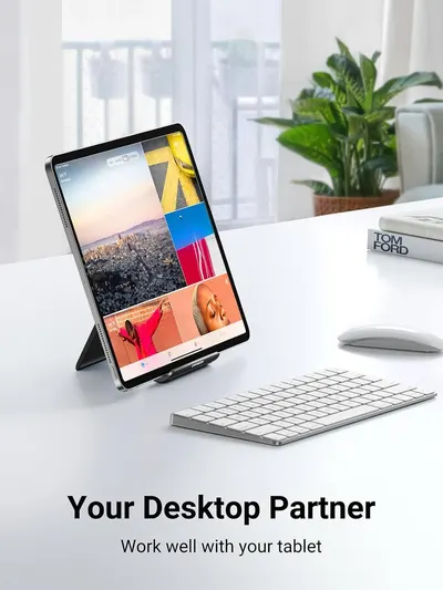 Demonstrates the product in a real-world office/home workspace environment to help shoppers visualize how the tablet stand integrates into their daily work setup.