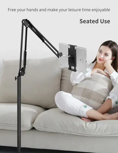 Demonstrates the product's ability to hold a tablet hands-free while the user relaxes on a couch, emphasizing comfort and convenience during leisure time.
