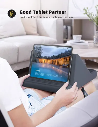 Demonstrates that the tablet stand provides a sturdy, comfortable viewing angle when sitting on the sofa, solving the problem of holding a tablet for extended periods.
