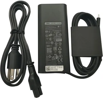 Shows the customer everything included in the package: the Dell 65W AC adapter, power cable, and charging cable, reassuring them they receive a complete charging solution.