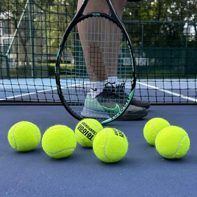 Shows the product in its natural real-world environment on a tennis court to help shoppers visualize the product in action and create an emotional connection with the sport.