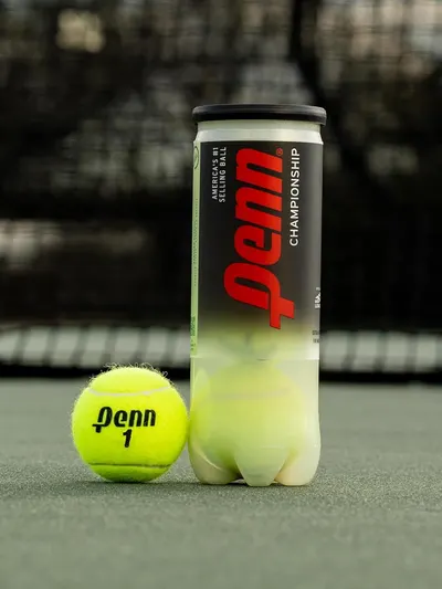 Showcases the product in its real-world usage environment on a tennis court to help shoppers visualize the product in action and reinforce its authenticity as championship-level tennis balls.
