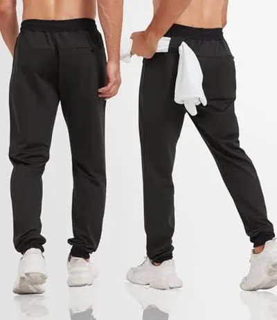 Demonstrates the functional pocket design and placement on the pants, showing shoppers the storage options available for carrying items like phones, wallets, or towels.