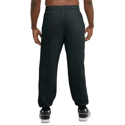 Shows the product worn on a model from the back to help shoppers visualize the fit, drape, and overall appearance of the sweatpants in a real-world context.