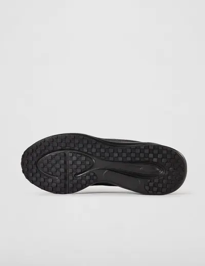 Displays the bottom sole of the shoe to show tread pattern and grip design, helping shoppers understand traction and durability features.