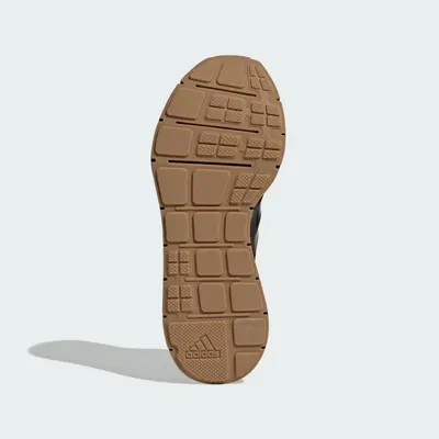 Displays the bottom sole of the shoe to show the tread pattern, grip design, and branding, helping shoppers understand the shoe's construction and traction features.