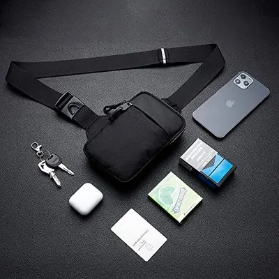 Shows what items can fit inside the bag and demonstrates its practical storage capacity for everyday essentials like phone, keys, cards, and earbuds.