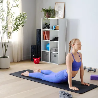 Demonstrates the product in use within a real home fitness setting to help shoppers visualize how the product fits into their lifestyle and workout routine.