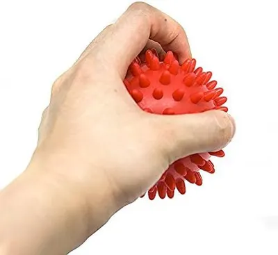 Shows the product in real-world use to help shoppers visualize how the massage ball fits in the hand and how it's used for muscle relief.