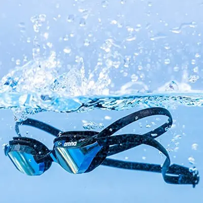 Demonstrates the product's waterproof capability by showing the goggles submerged in water with splashing, reassuring shoppers that the product is designed for aquatic use and can withstand water…