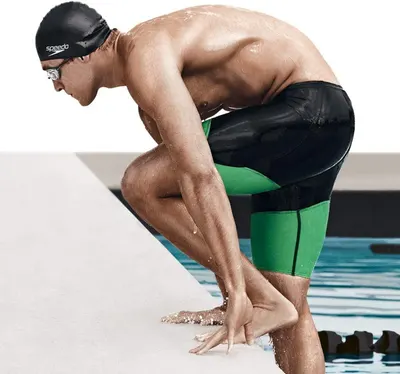 Showcases the product in an authentic competitive swimming context to help shoppers visualize the swimwear's performance and fit during athletic use.