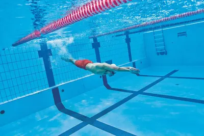 Shows the product being used in a real-world swimming pool environment to help shoppers visualize the product in action during actual use.