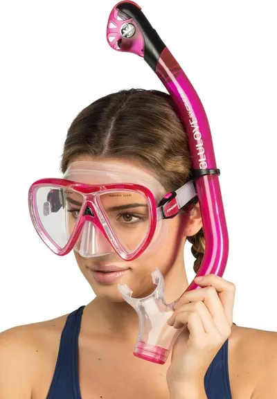 Shows the snorkel and mask set being worn by a model to help shoppers visualize the product in use and understand how it looks when worn.