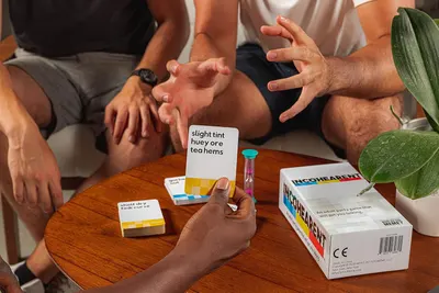 Demonstrates the product being used in a real-world social setting to show shoppers how the game naturally fits into casual gatherings and creates engaging moments with friends.