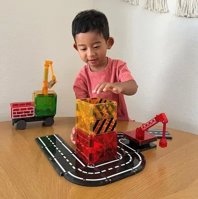Demonstrates the product in a real-world home setting with a child actively engaged in play, helping shoppers visualize how the toy will be used and enjoyed.