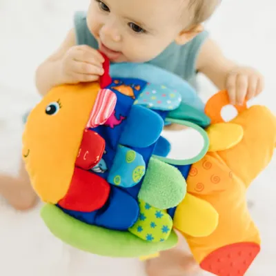 Shows the product in use by a young child in a natural, real-world context to help parents visualize how their child would interact with and enjoy the toy.