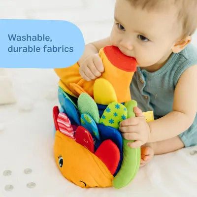 Reassures parents that the toy is made from washable and durable fabrics, making it practical for babies and easy to maintain.