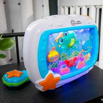 Shows the Baby Einstein toy in a real-world nursery environment to help parents visualize how the product fits into their home and daily routine.