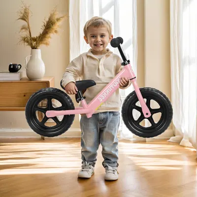 Demonstrates the product in a real-world home setting to help shoppers visualize how the balance bike fits into everyday life and appeals to young children.