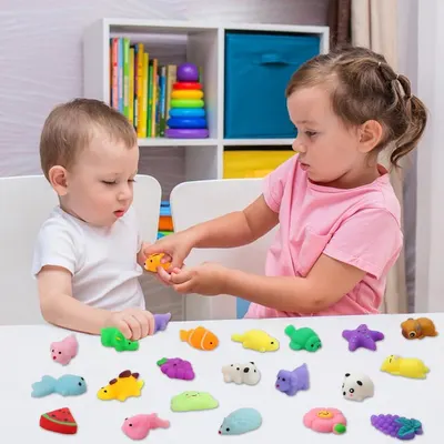Shows the product being used in a real-world play scenario with children, demonstrating the toy's appeal and social play value in a home environment.