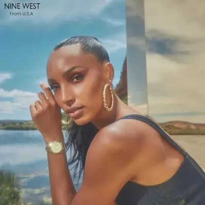 Communicates the brand name 'NINE WEST' and its U.S.A. origin to establish brand identity and heritage, building trust and recognition with shoppers.