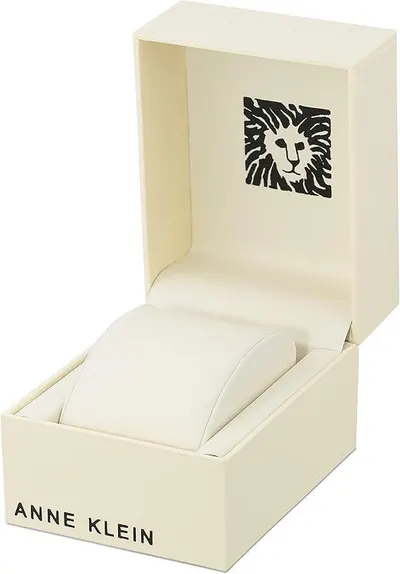 Showcases the Anne Klein brand identity through premium packaging with the brand's signature lion logo, reinforcing brand recognition and luxury positioning.