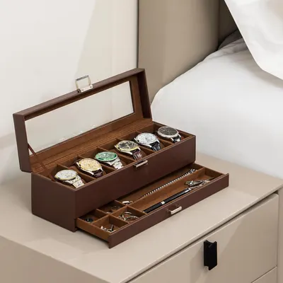 Demonstrates what the customer receives with the product—a complete storage solution with dedicated compartments for watches in the top tier and a pull-out drawer for jewelry and accessories,…
