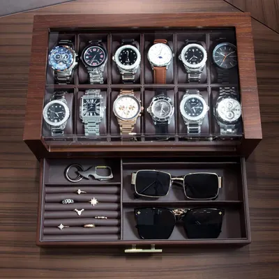 Shows the complete storage solution and organizational capacity of the product, demonstrating that it can hold multiple watches, jewelry pieces, sunglasses, and accessories in dedicated compartments.