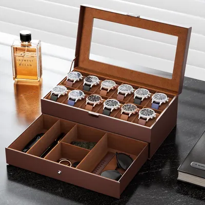Shows the complete storage organizer with multiple watches displayed in the top compartment and additional accessories (sunglasses, watch bands, jewelry) in the bottom drawer, demonstrating the…