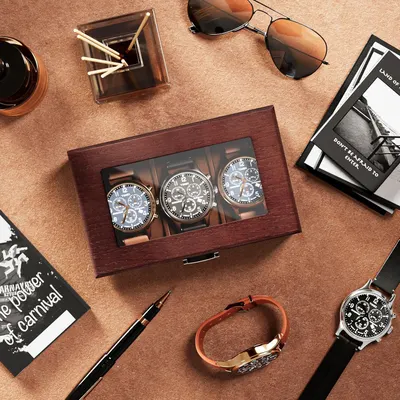 Shows the customer everything included in the purchase: three watches displayed in an elegant wooden presentation box, communicating value and premium packaging.