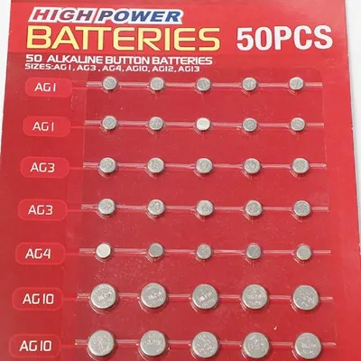 Shows the complete assortment of 50 alkaline button batteries included in the package, organized by size type to help shoppers understand the variety and quantity they will receive.