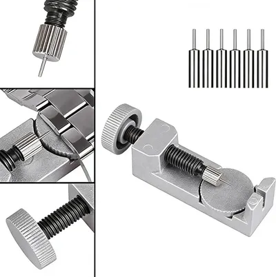 This image breaks down the physical components of a watch band link removal tool, showing the knurled adjustment knobs, pin pusher mechanism, spring-loaded parts, and included pins to help shoppers…
