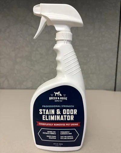 Communicates multiple distinct benefits of the stain and odor eliminator in a segmented layout, showing professional strength, enzymatic formula, permanent odor elimination, stain removal, and…