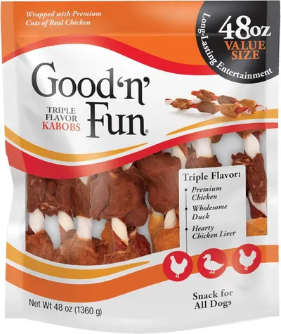 Communicates multiple product benefits including the triple flavor variety, premium ingredients, and value size to appeal to dog owners looking for quality and variety in pet treats.