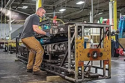 Demonstrates the product being used in a real-world industrial/warehouse environment to show its practical application and build credibility with professional users.