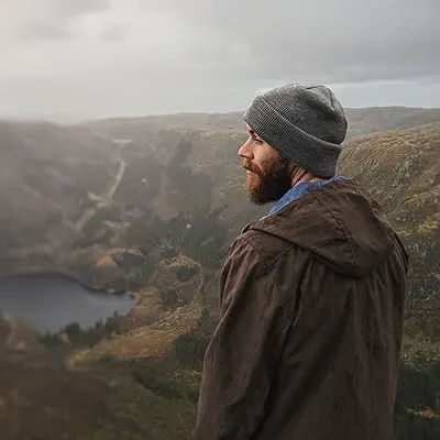 Demonstrates the product being used in a real-world outdoor setting to convey its suitability for adventure, travel, and rugged environments.