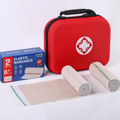 Shows everything included in the first aid kit purchase, including the red carrying case, elastic bandages, and packaging to help shoppers understand the complete bundle they will receive.