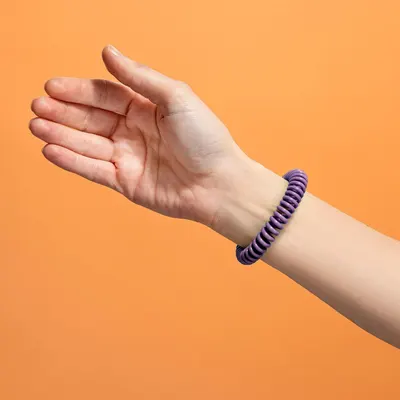 Shows the product worn on a wrist in a real-world context to help shoppers visualize how it looks when worn, without any text or feature callouts.