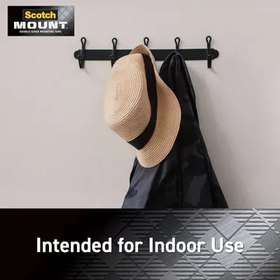 Demonstrates that the Scotch Mount double-sided mounting tape is designed for indoor applications, showing it being used to mount a coat rack on a wall.