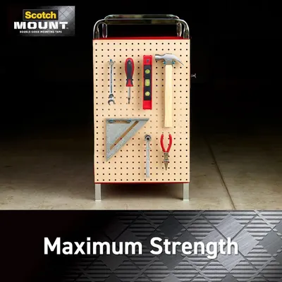 Demonstrates the product's superior holding power by showing it can securely mount heavy tools on a pegboard, reassuring shoppers that this mounting tape is strong enough for demanding applications.