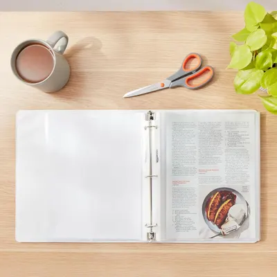 Shows the product (recipe binder) in a natural, relatable home environment to help shoppers visualize how they would use it in their own kitchen or workspace.