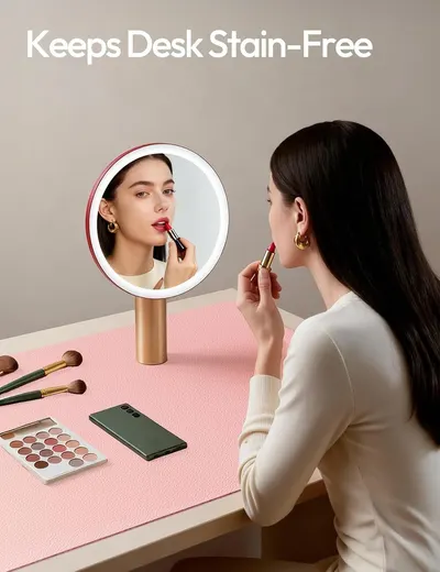 Communicates that the product (likely a desk mat or protective surface) keeps the desk clean and stain-free during makeup application and daily use.