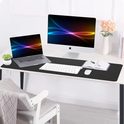 Demonstrates the product in a real-world home office environment to help shoppers visualize how the desk mat fits into a modern, clean workspace.