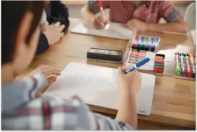 Demonstrates the product being used in an authentic classroom or home learning environment to help shoppers visualize the markers in everyday use.