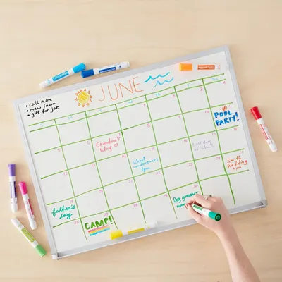 Demonstrates the whiteboard calendar's versatility for organizing family schedules, tracking events, appointments, and activities throughout the month.