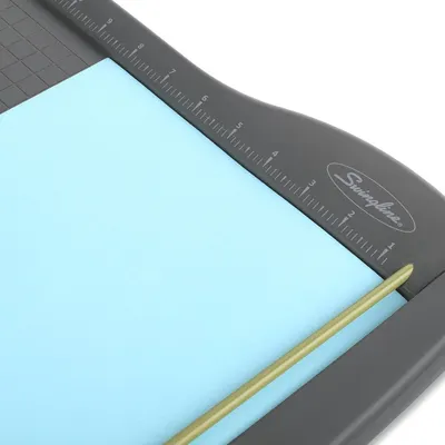 Provides a clean, catalog-style view of the paper trimmer product showing its design, ruler markings, and cutting mechanism without distractions.