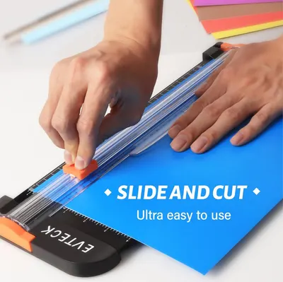 Demonstrates how to use the paper trimmer by showing the simple slide-and-cut action, reassuring shoppers that the product is ultra easy to use. Highlights the primary benefit of effortless…