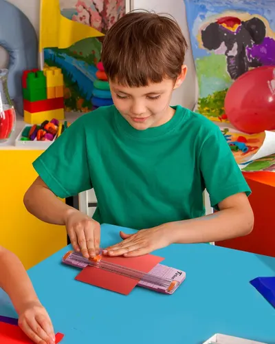 Demonstrates the product in a real-world context showing a child engaged in arts and crafts, helping shoppers visualize how the product fits into everyday creative activities.