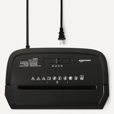 Provides a clean, catalog-style view of the Amazon Basics paper shredder showing the product design, control panel, and power cord without distractions.